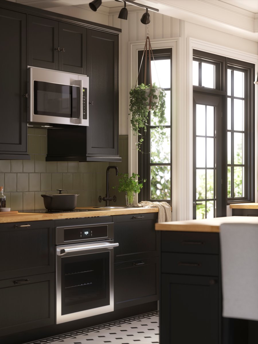 A kitchen island in a kitchen with LERHYTTAN fronts - IKEA