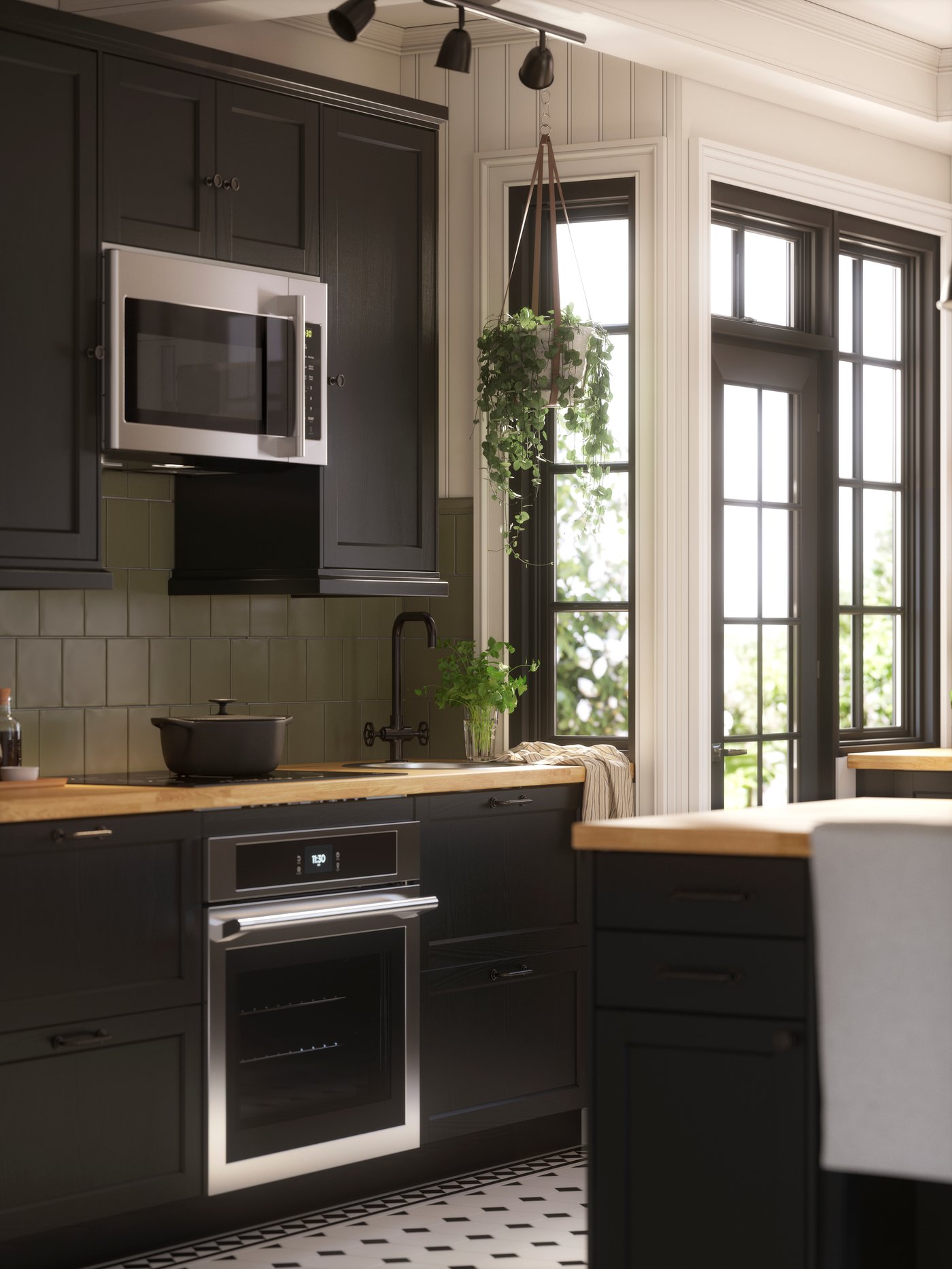 A kitchen island in a kitchen with LERHYTTAN fronts - IKEA