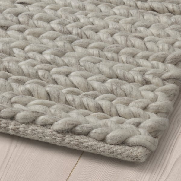A handmade/off-white HJORTSVANG rug