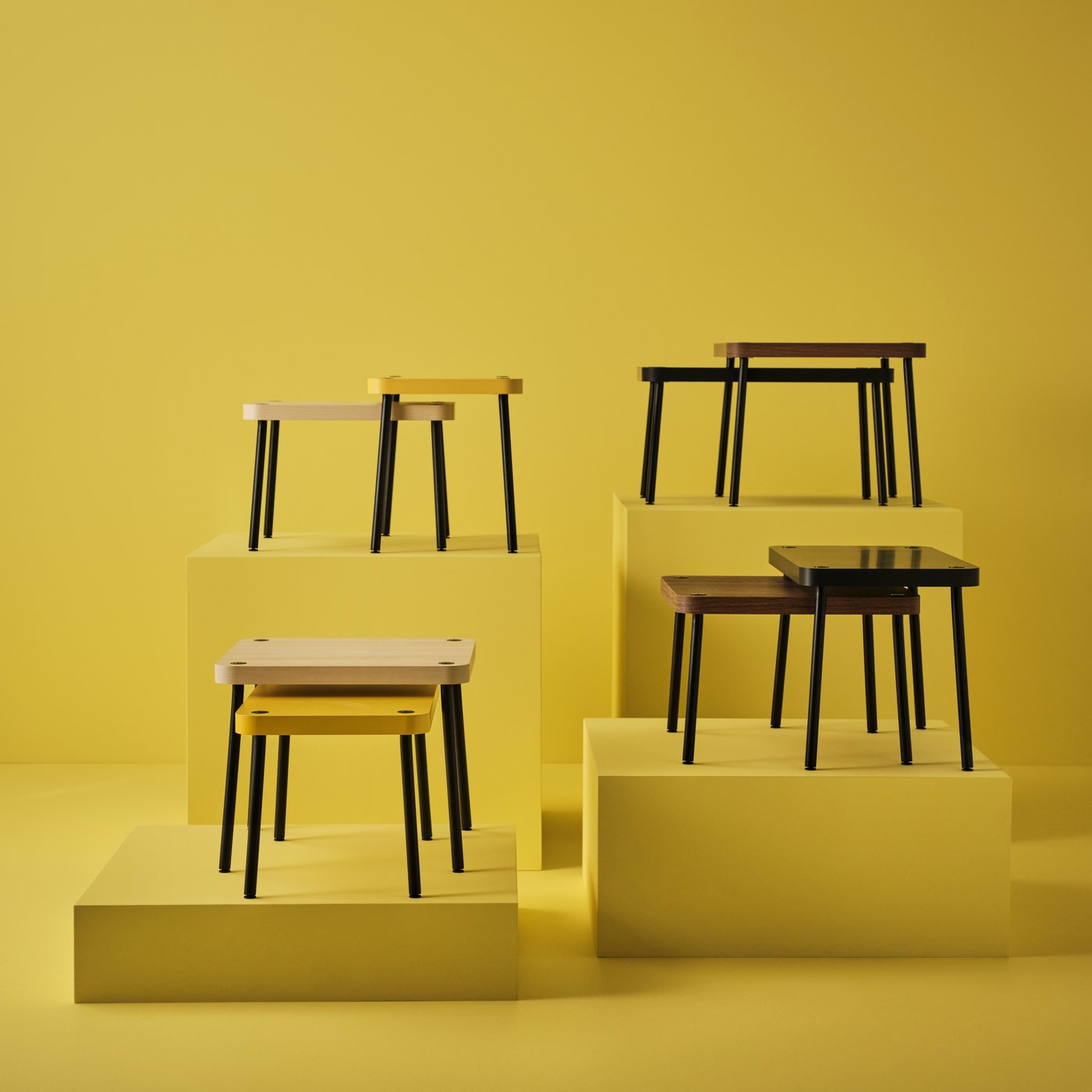 A grey/walnut effect SONHULT nest of tables