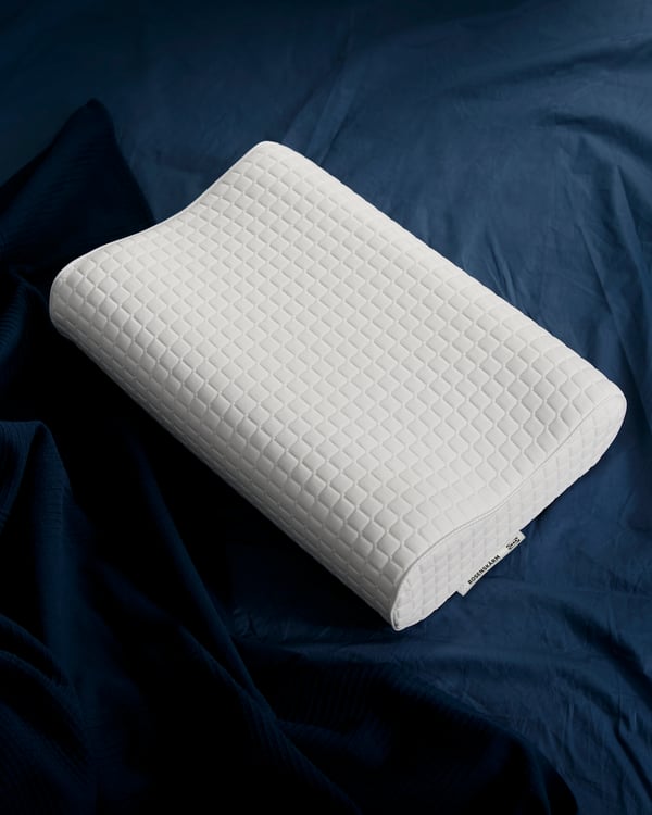 A ROSENSKÄRM ergonomic pillow, side/back sleeper in the bedroom