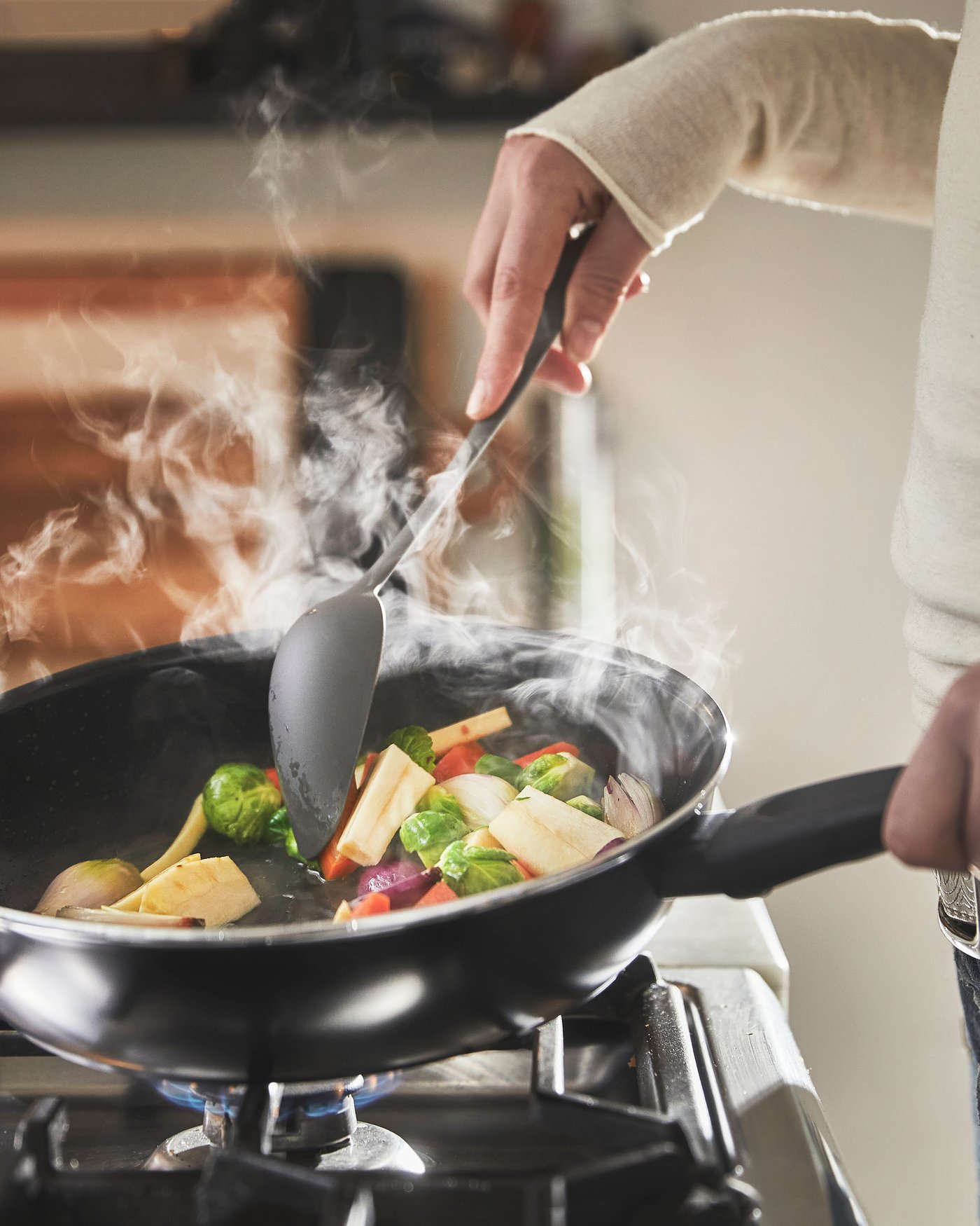 A non-stick coating black HEMLAGAD sauté pan with lid