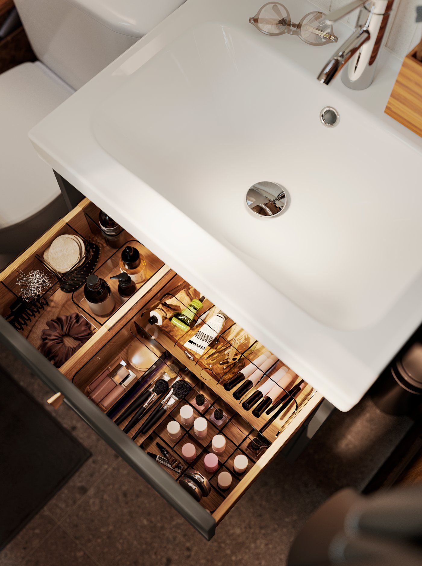 The top drawer of a dark grey HAVBÄCK wash-stand is pulled out and there are VISSLAÅN boxers and drawer organisers inside.