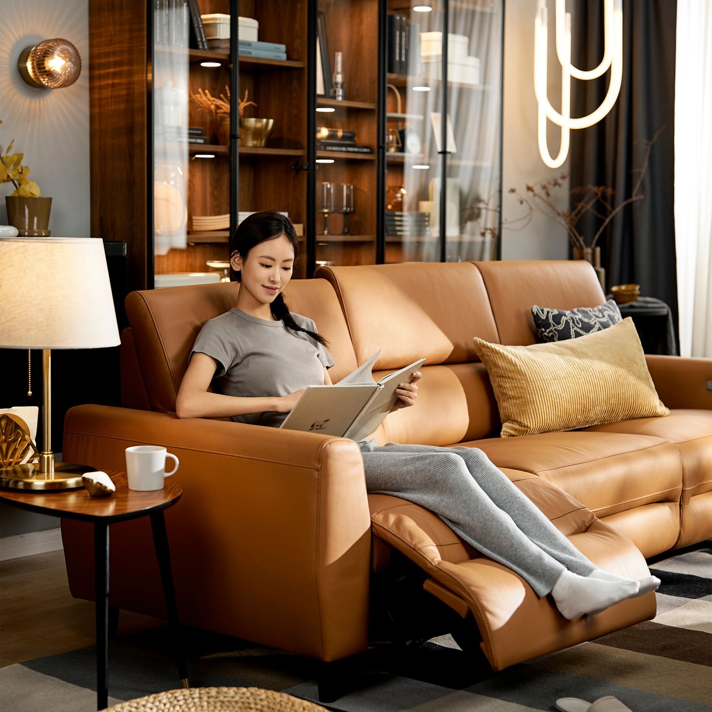 A Grann/Bomstad golden-brown RULLERUM 3-seat sofa w 2 electric recliners