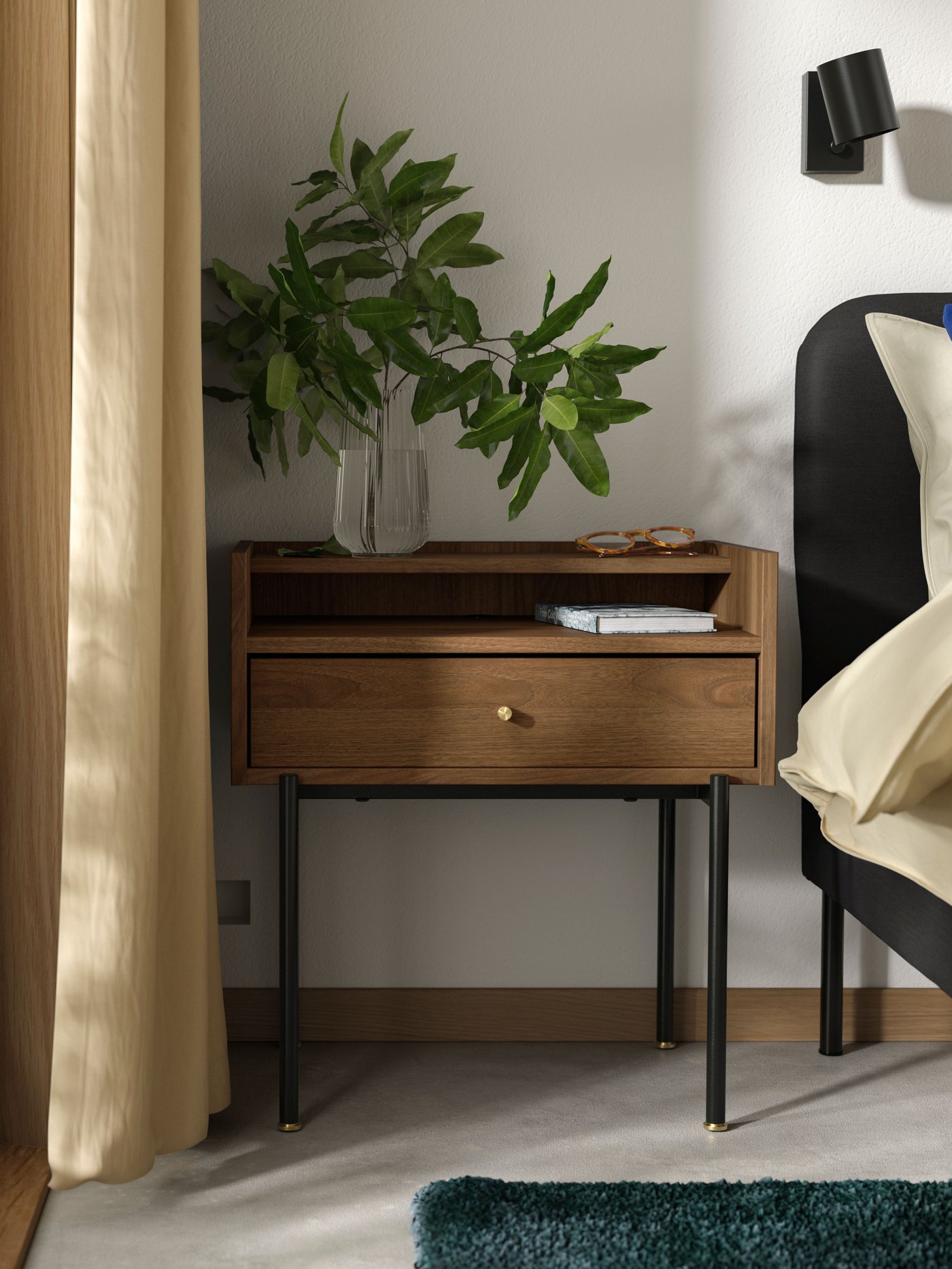 A brown walnut effect RÅDMANSÖ bedside table