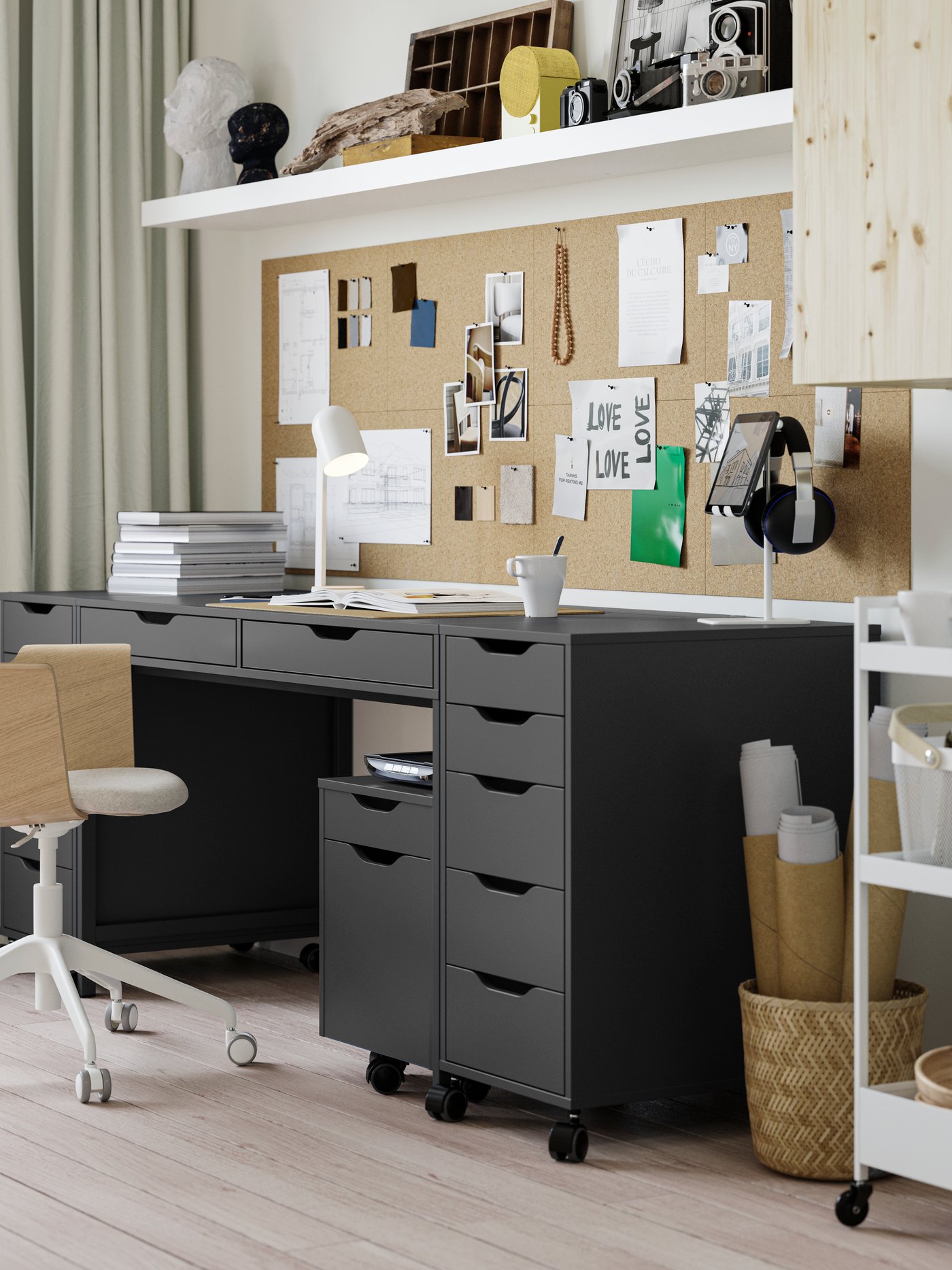A study corner with ALEX desk and three drawer units in dark grey-black, with a FJÄLLBERGET conference chair in front of it.