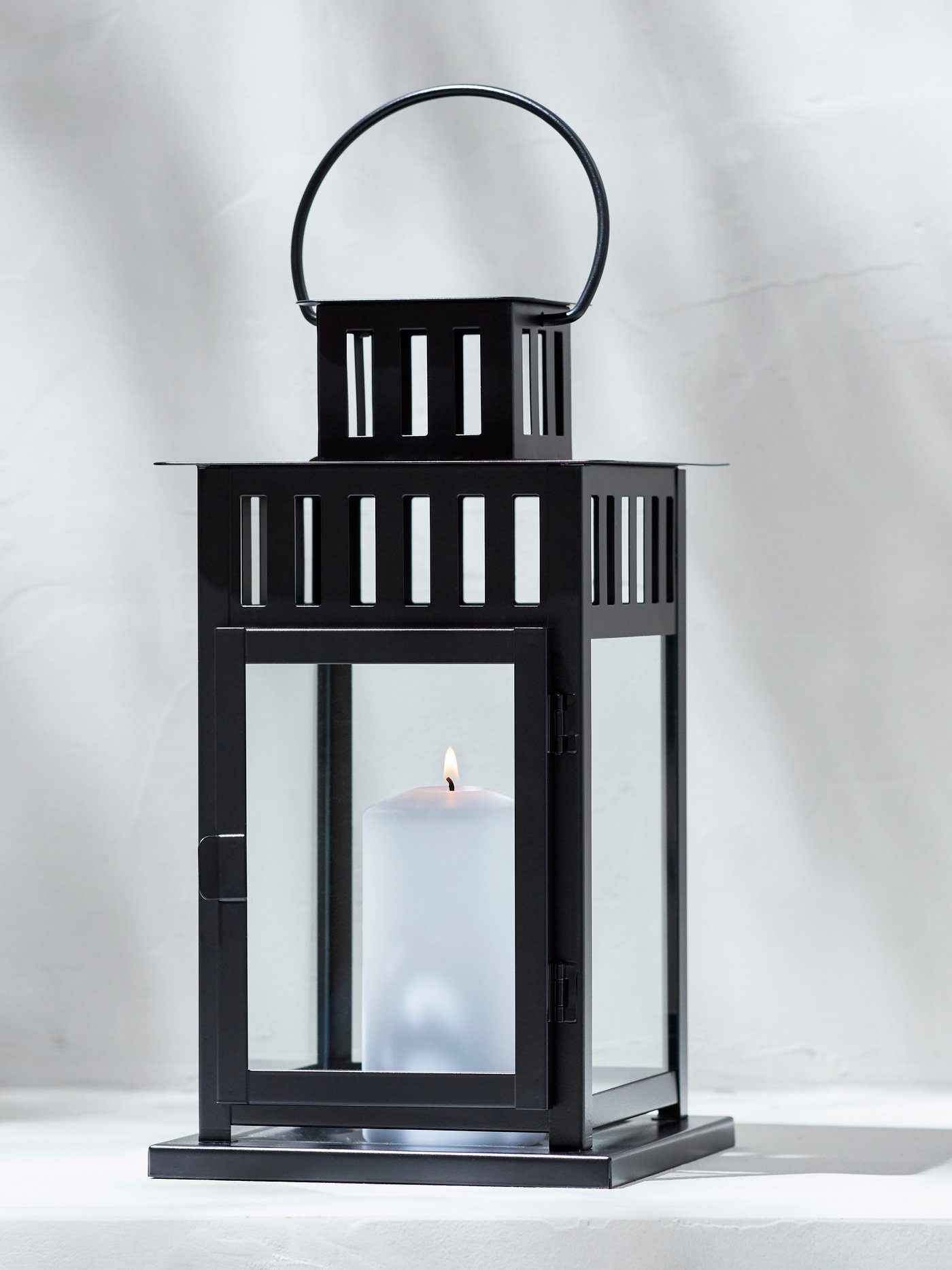 An in/outdoor black BORRBY lantern for block candle