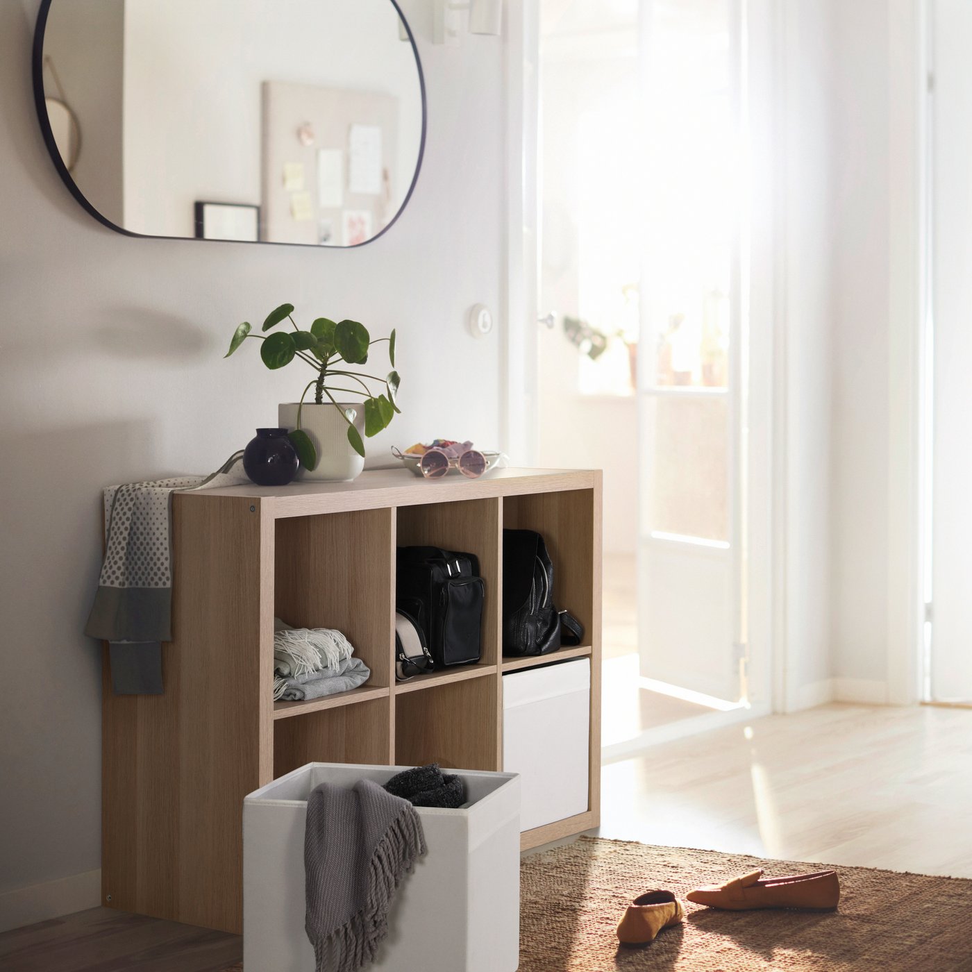 A white stained oak effect KALLAX shelving unit