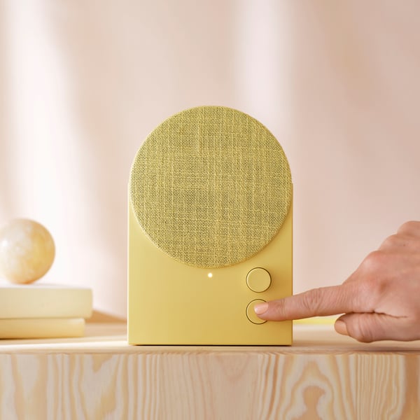 An yellow NATTBAD Bluetooth speaker