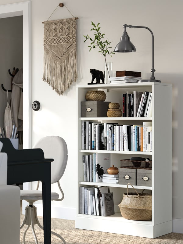 A white HAVSTA shelving unit with plinth