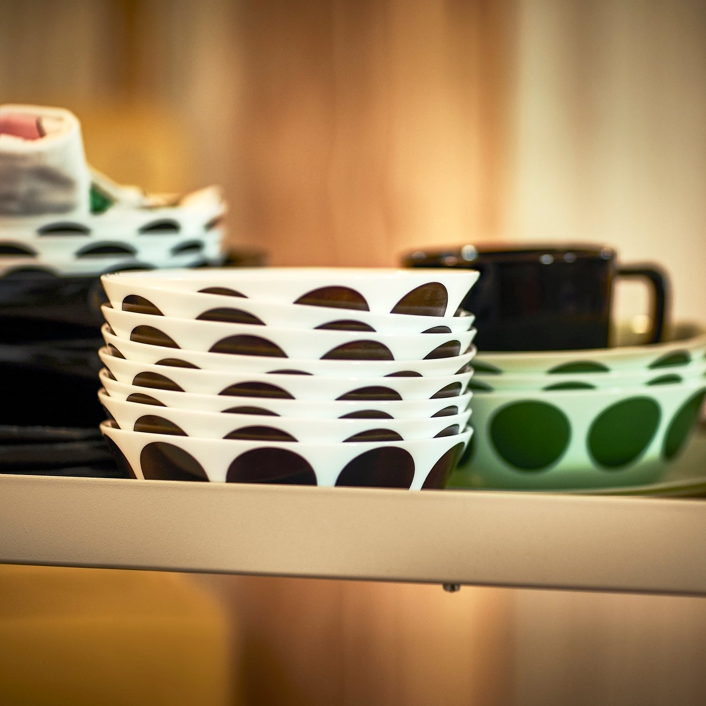 A white black/dot pattern OFTAST bowl