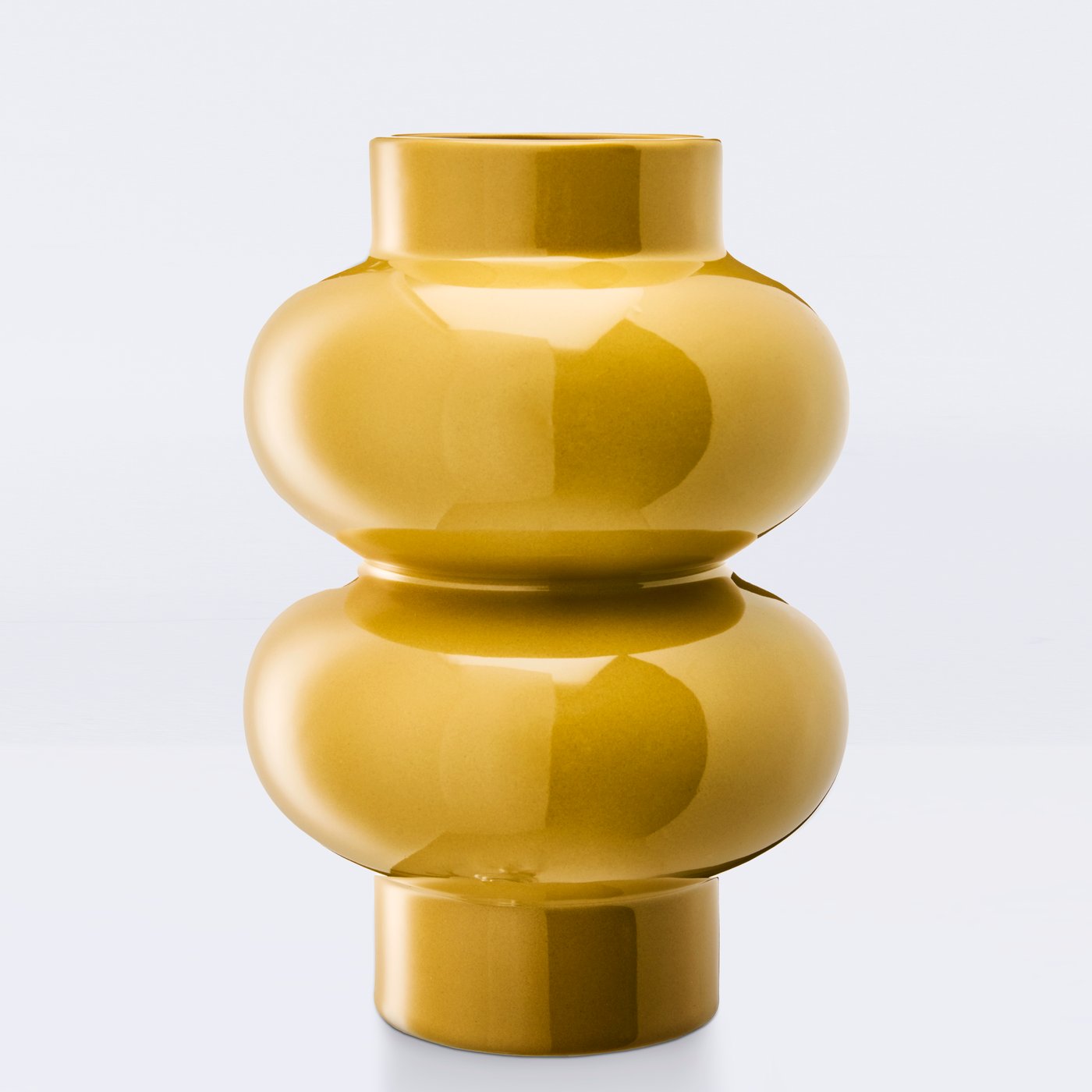 A yellow-beige PÄRLHÄGG vase with a rounded, elegant silhouette, showcasing its smooth glossy finish.