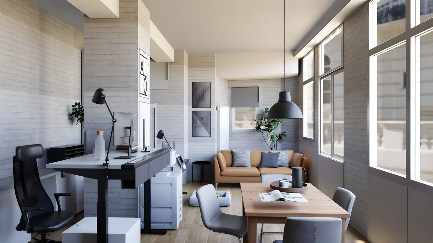 Blick in Richtung Sofa mit dem Arbeitstisch und den Schreibtischen