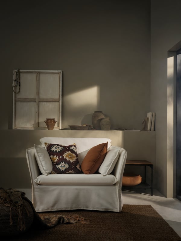 A brown-yellow GURLI cushion cover in the living room