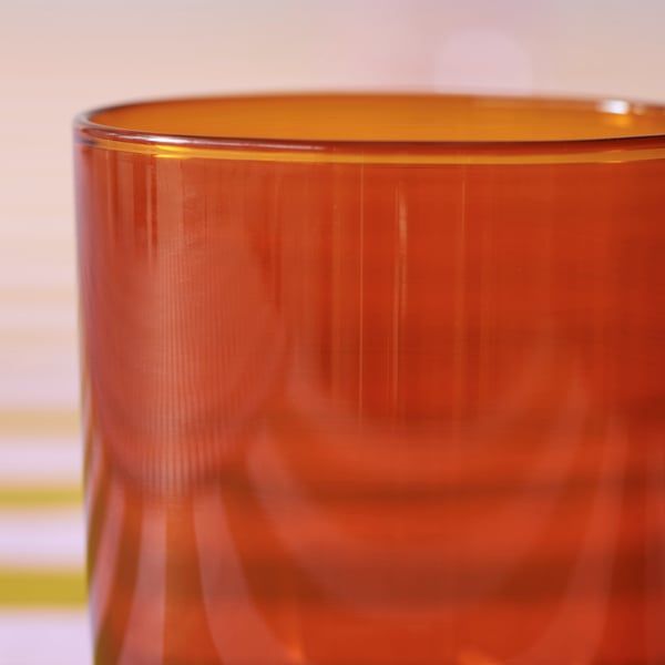 A TESAMMANS pendant lampshade is made of metal and has three parts with three different tones of yellow.