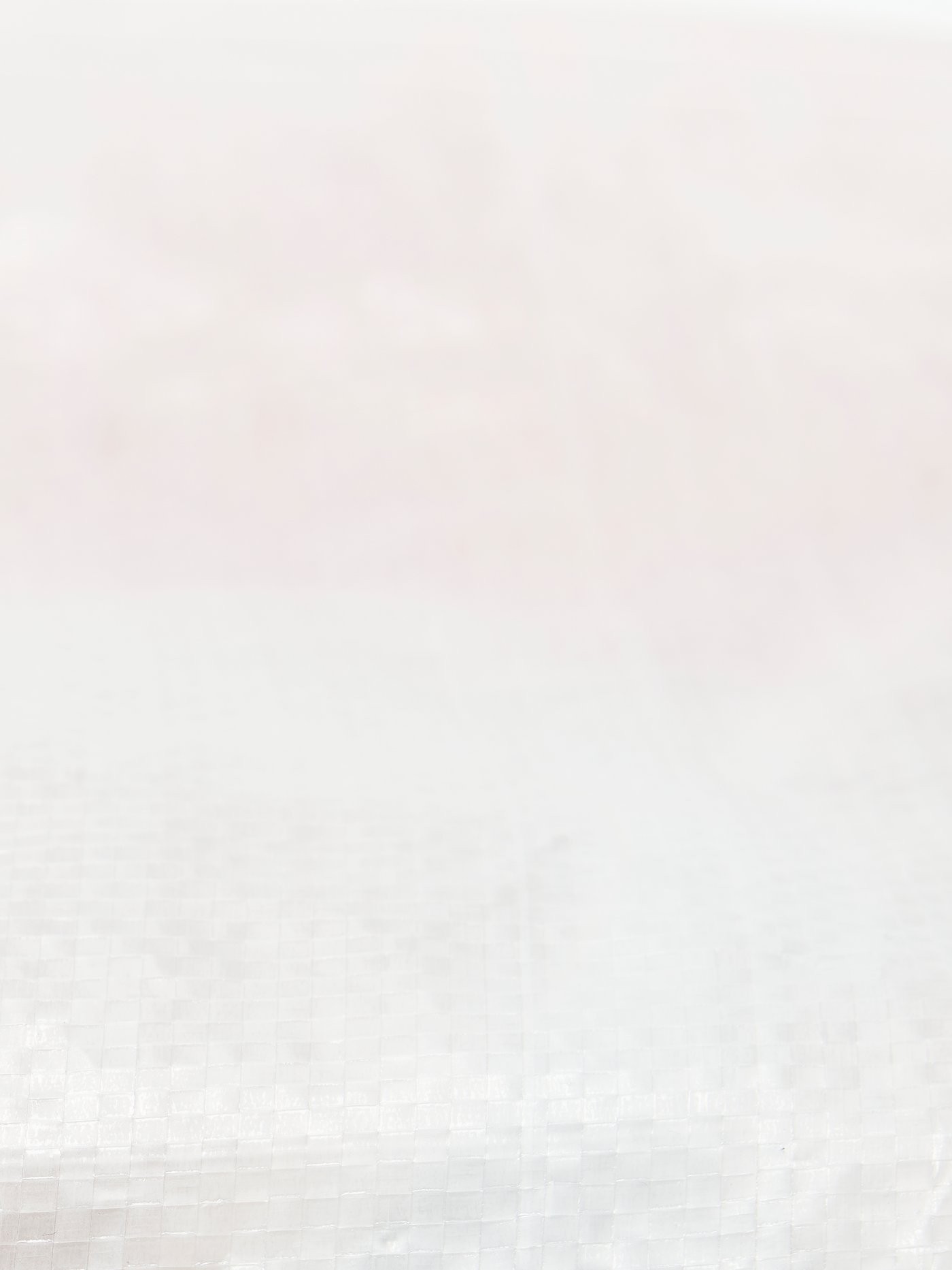 Prikaz izbliza materijala PÄRKLA vreće za obuću. Dio veće slike.