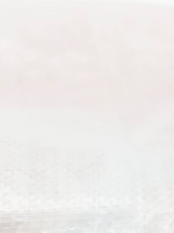 A close-up of the material of a PÄRKLA shoe bag. A section of a larger image.