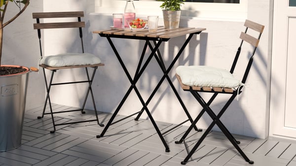 A black/light brown stained TÄRNÖ table+2 chairs, outdoor