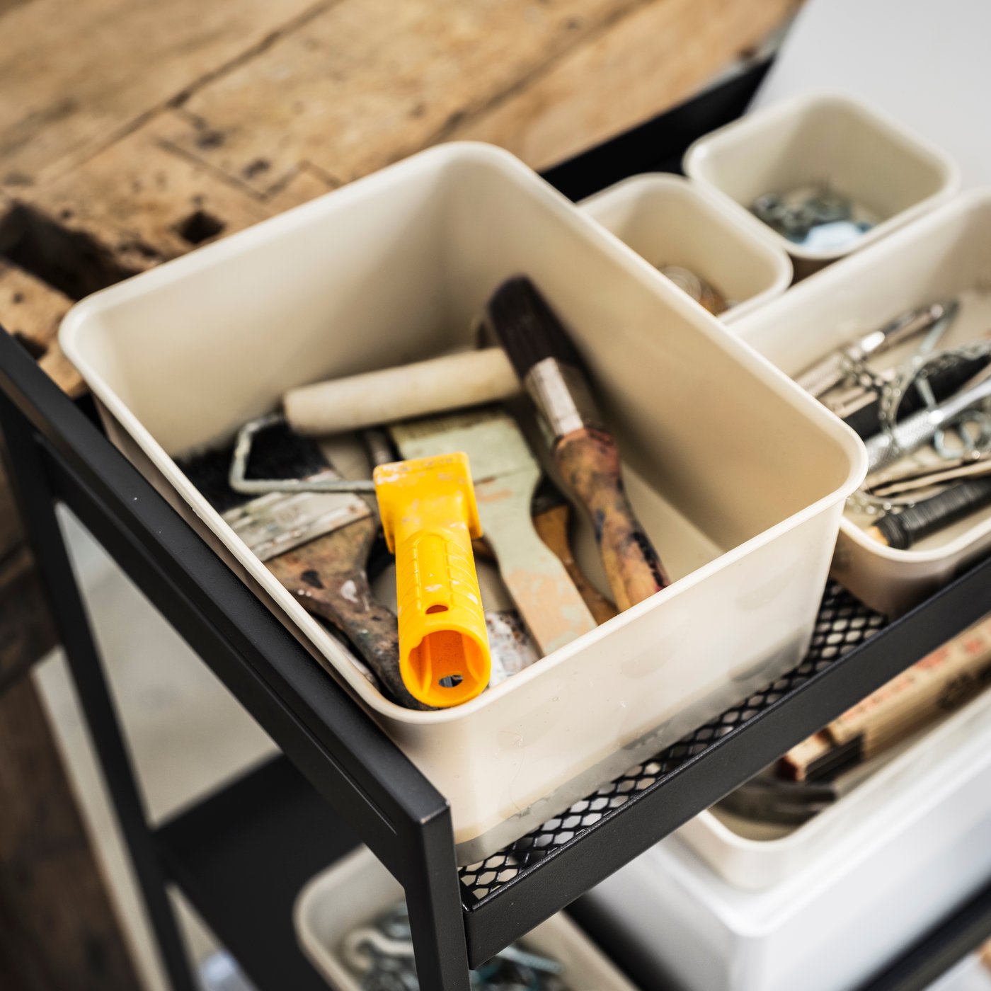 A plastic/beige NOJIG organiser