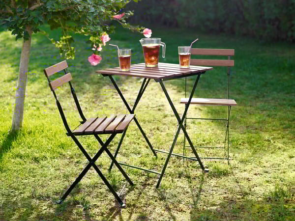 A black/light brown stained TÄRNÖ table+2 chairs, outdoor
