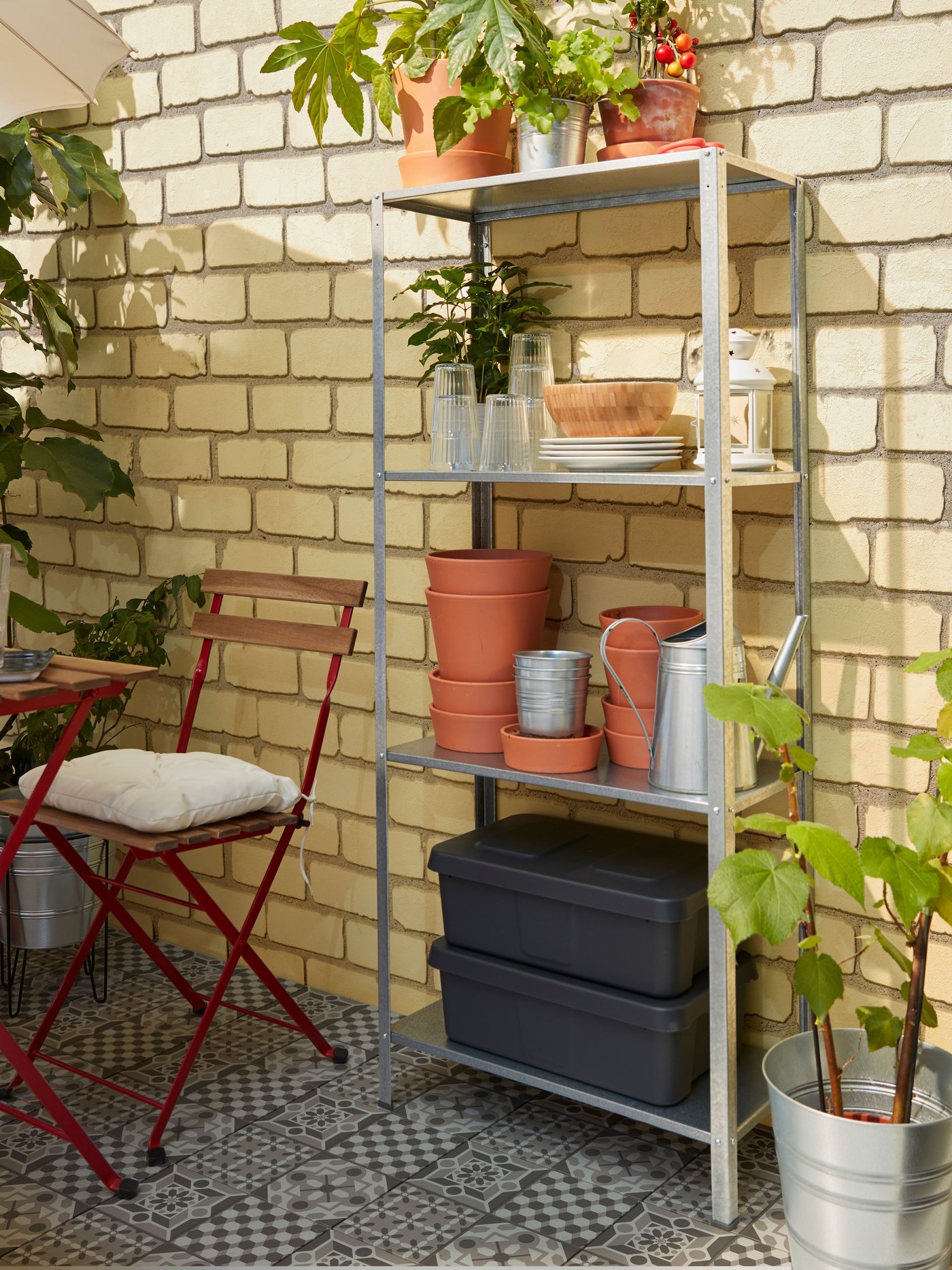 A HYLLIS shelving unit on a balcony.