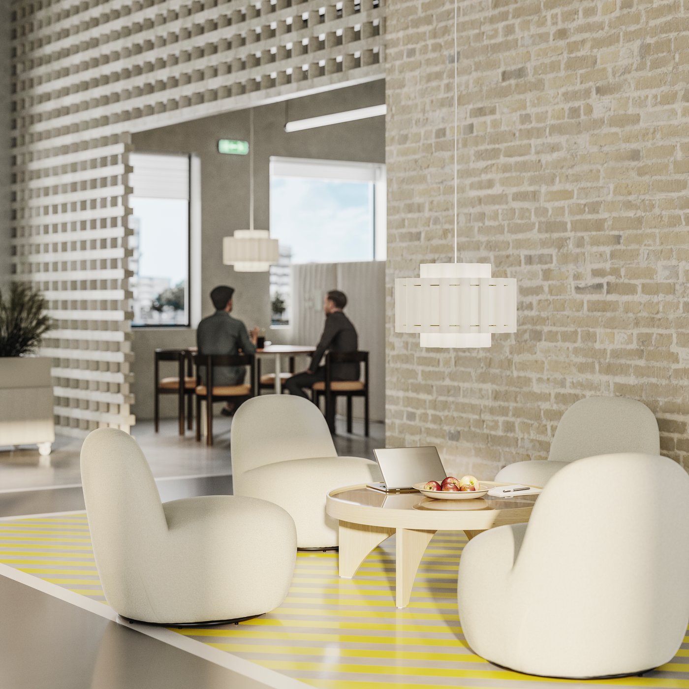 Four white easy chairs around a coffee table, set against the light brick wall of an open-plan office