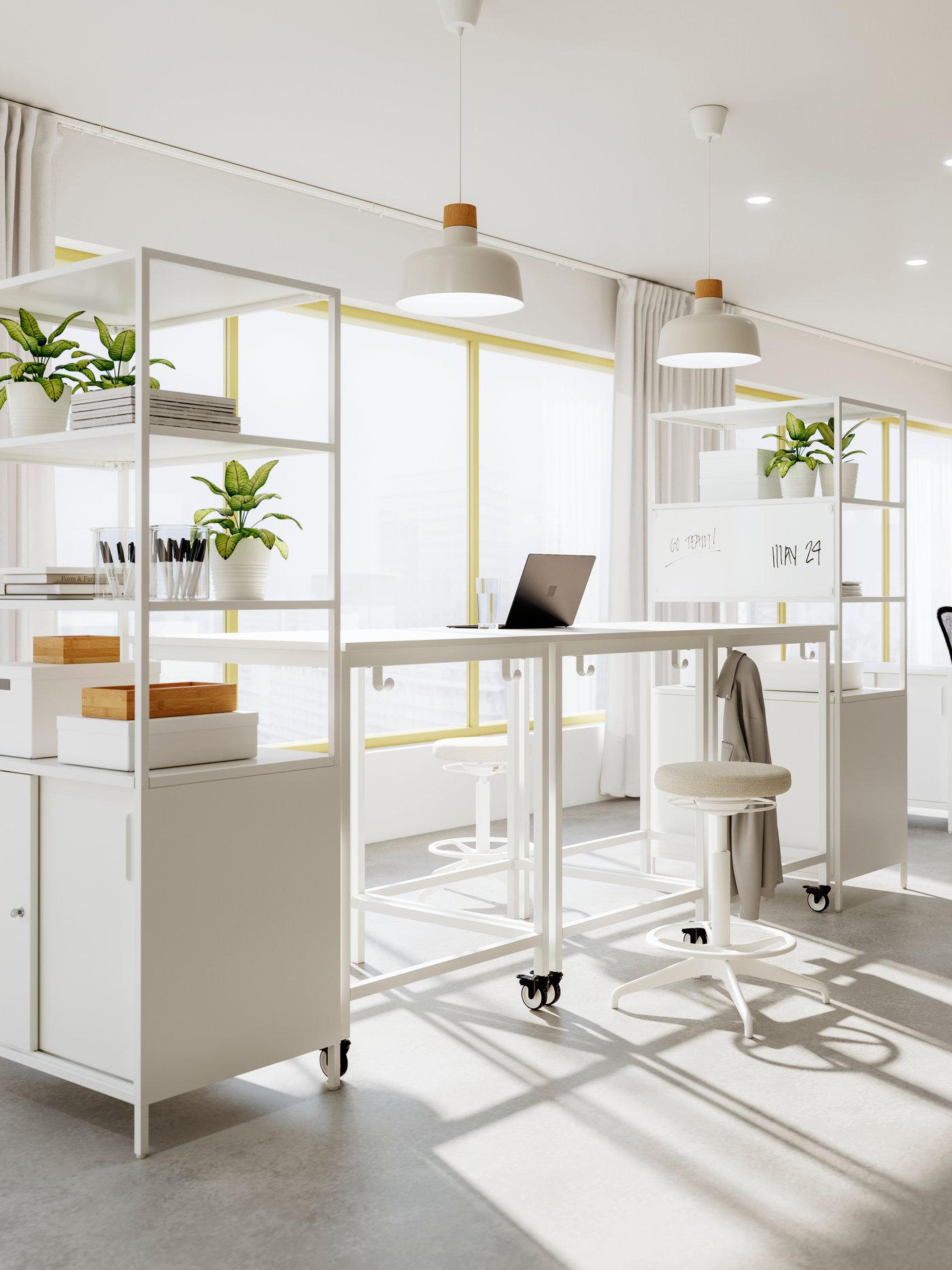 Three high beige/white TROTTEN tables placed close to a large window creating a standing meeting zone.