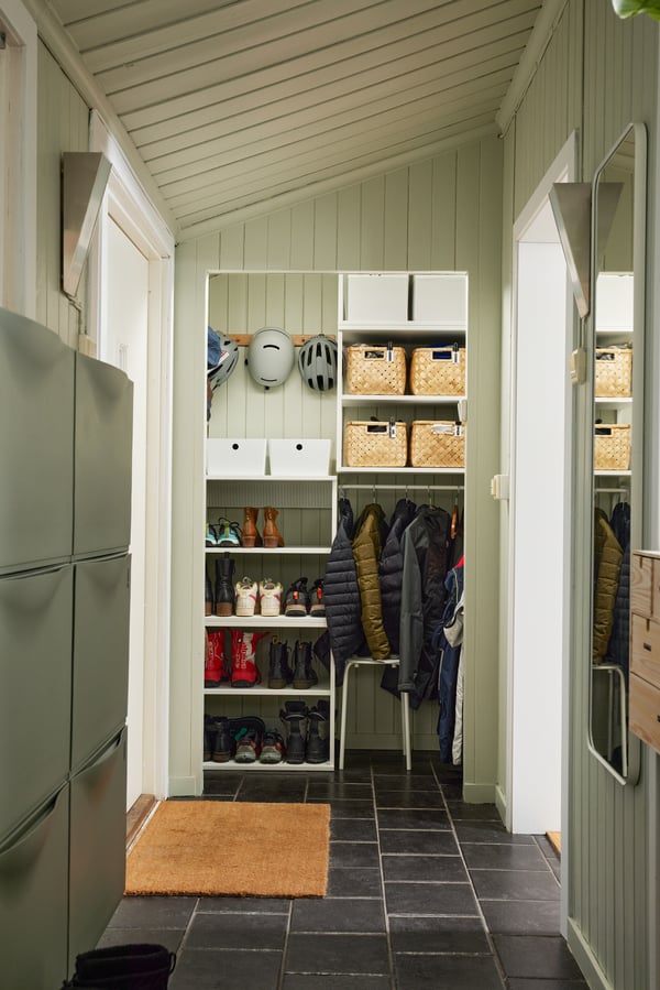 A grey-green TRONES shoe cabinet/storage