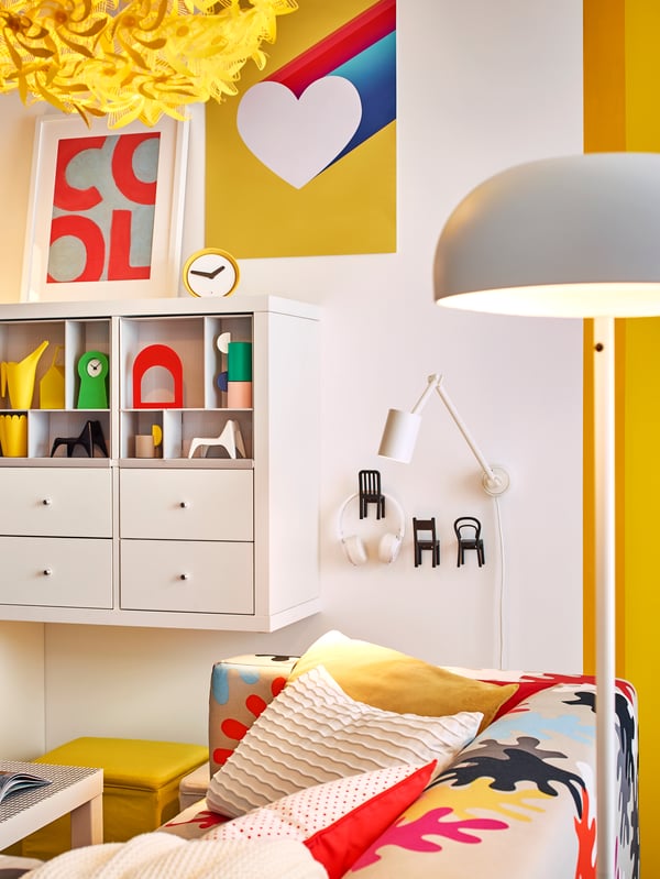 A white KALLAX shelving unit in the living room