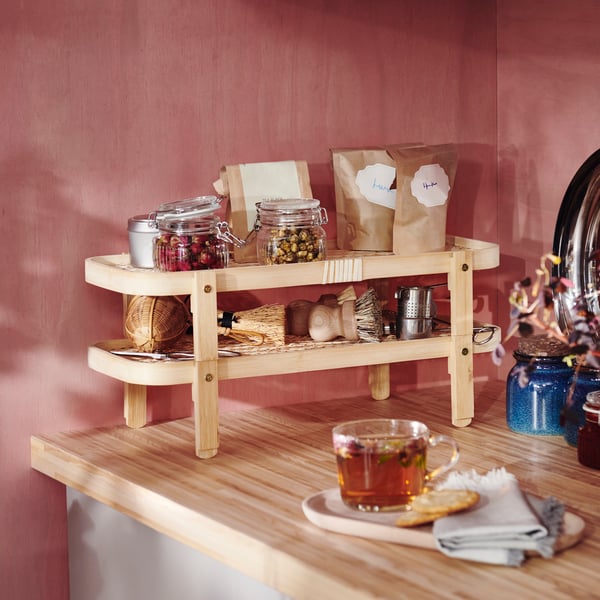 A bamboo KÖSSEBÄR food drying rack with 2 trays