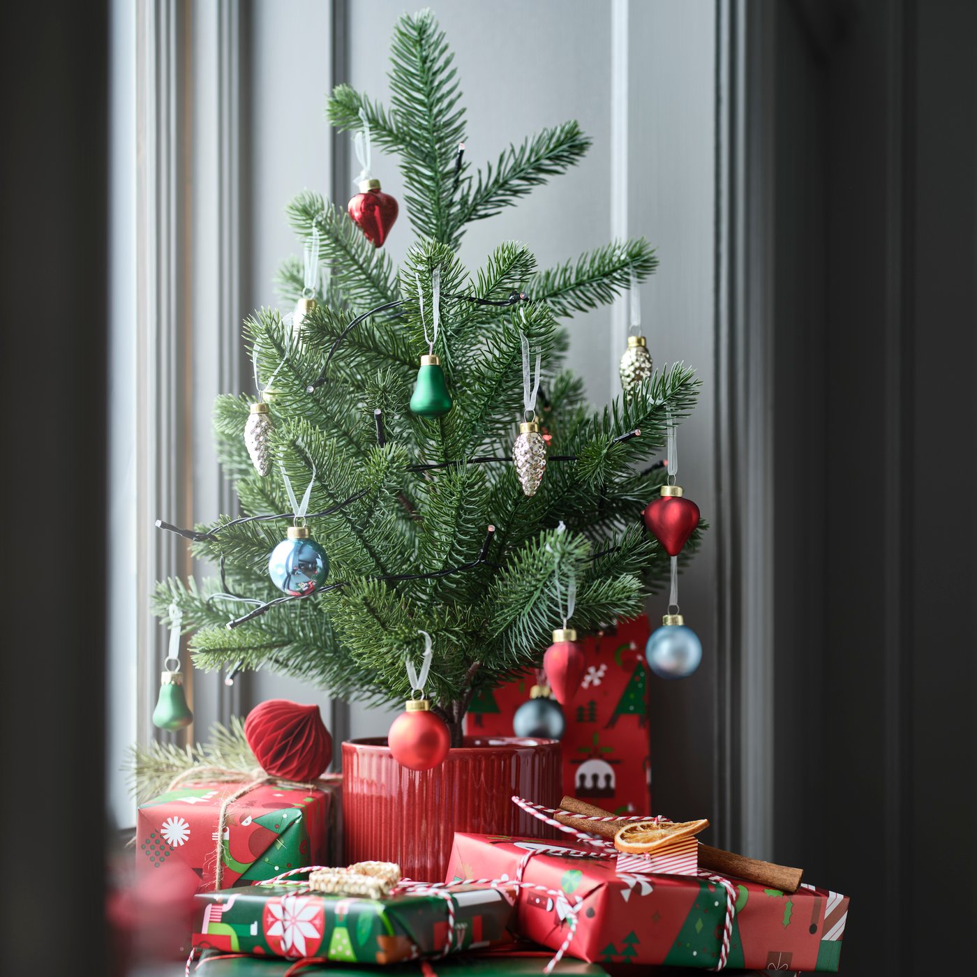 VINTERFINT christmas artificial potted plant, indoor, on the window sill.