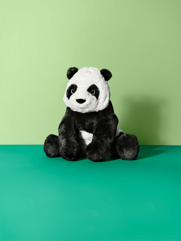 A white/black KRAMIG soft toy.
