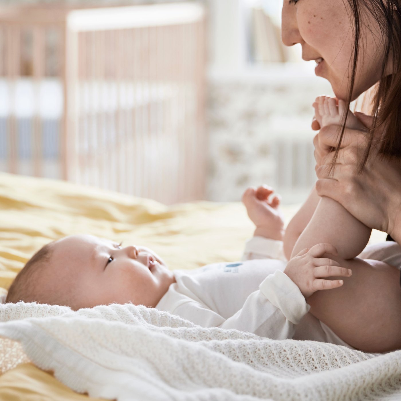 A beech SNIGLAR cot in the childrens room