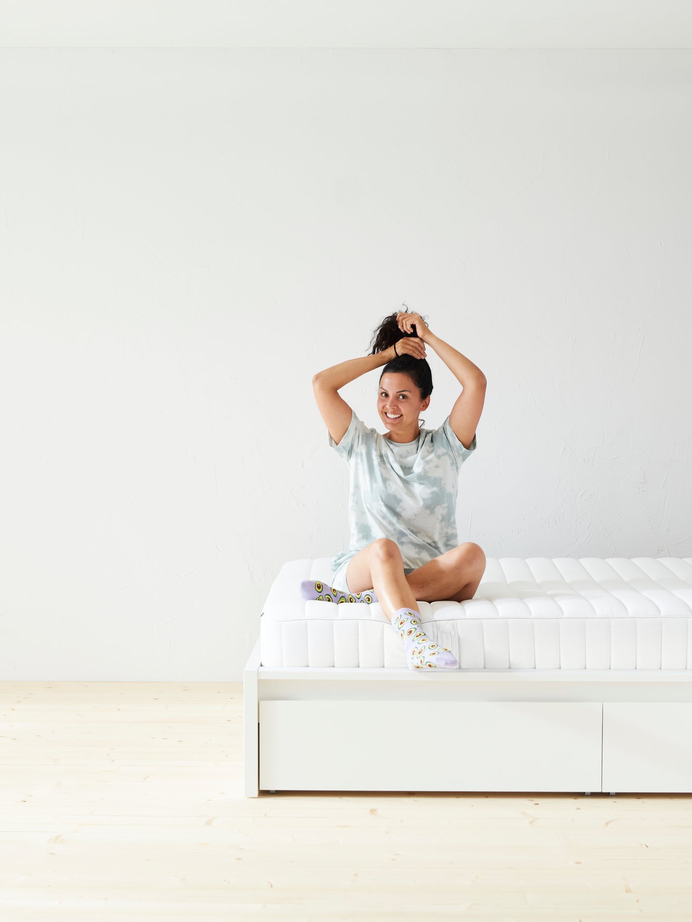 A firm/white VALEVÅG pocket sprung mattress