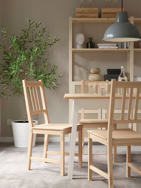 A light brown stained/white stained PINNTORP table