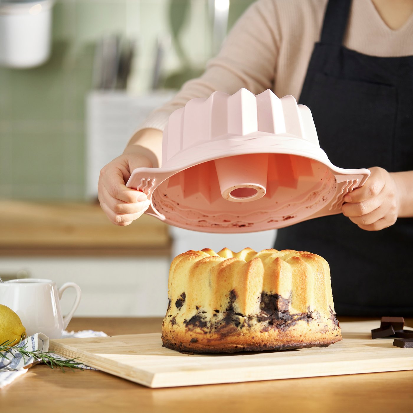 A pale pink BAKTIDER fluted ring cake mould in the kitchen
