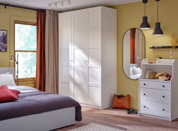 A red-orange VIGDIS cushion cover