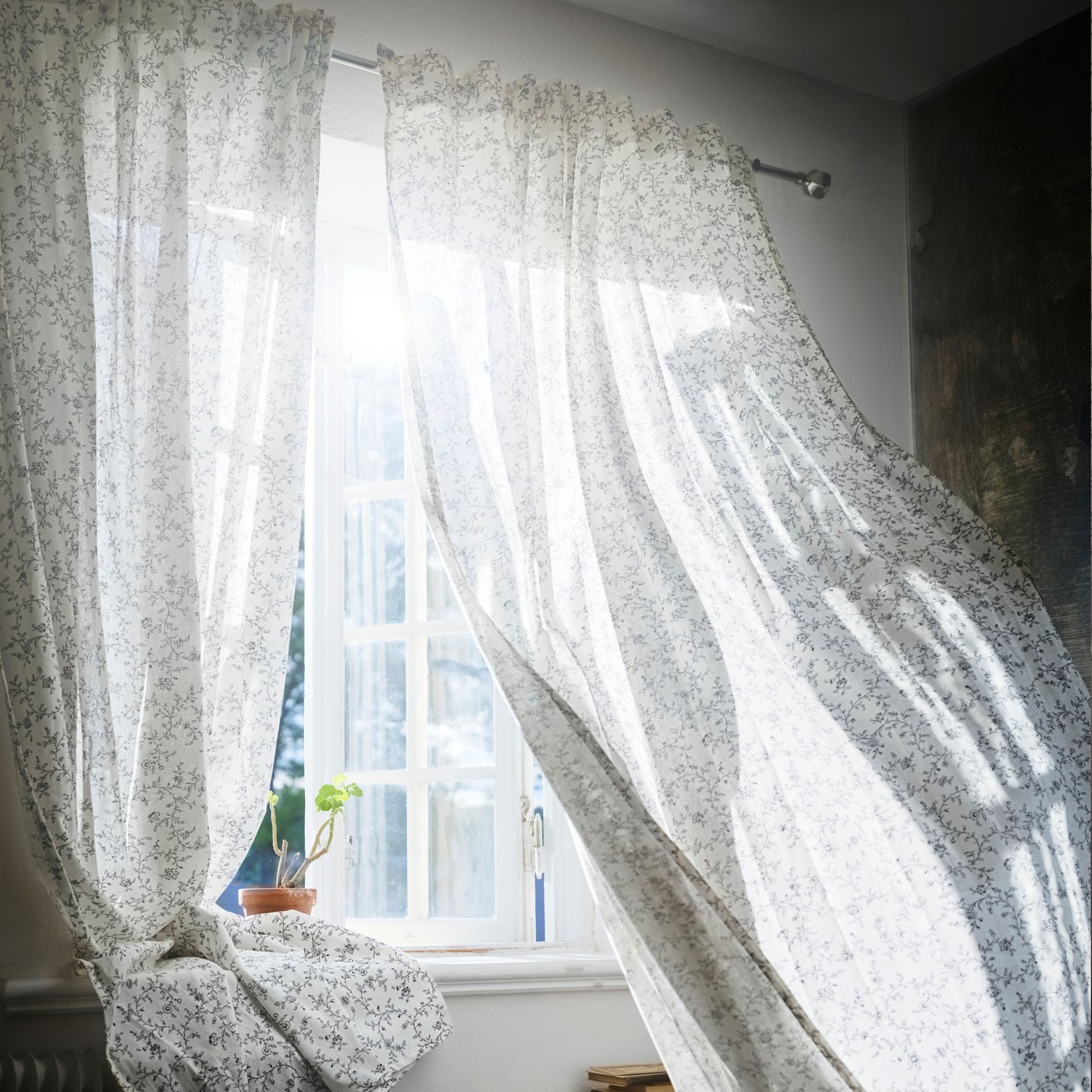 A white/grey BRANDNÄVA curtains, 1 pair in the living room