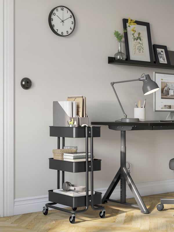 A black RÅSKOG trolley