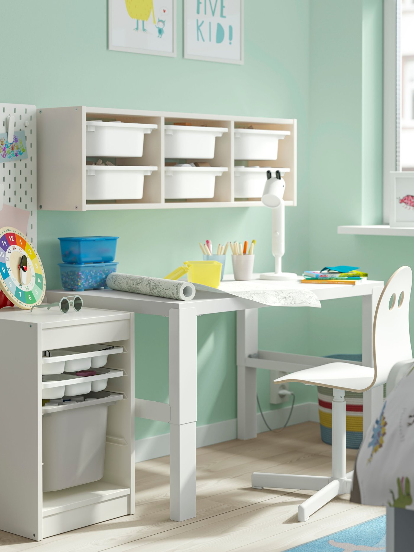 A white SIBBEN children's desk chair and white PÅHL desk in children's room