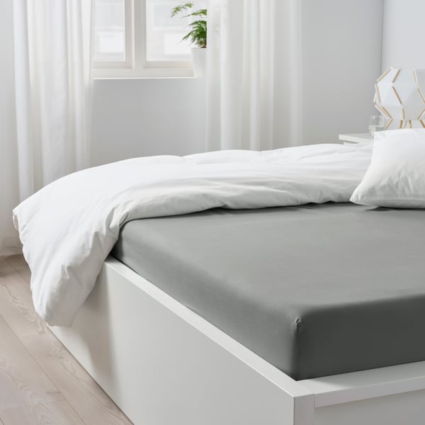 A light grey DVALA fitted sheet