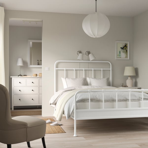 A white STJÄRNÖ bed frame in the bedroom
