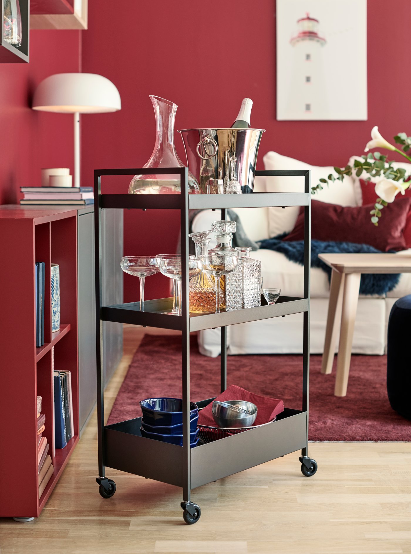 A black NISSAFORS trolley in the living room