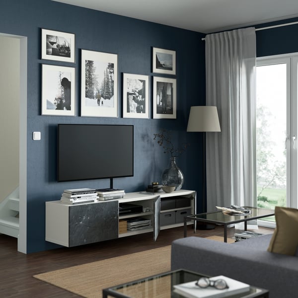 A white/Bergsviken black BESTÅ TV bench with doors