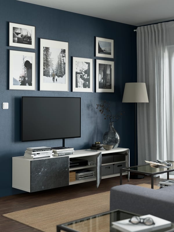 A white/Bergsviken black BESTÅ TV bench with doors
