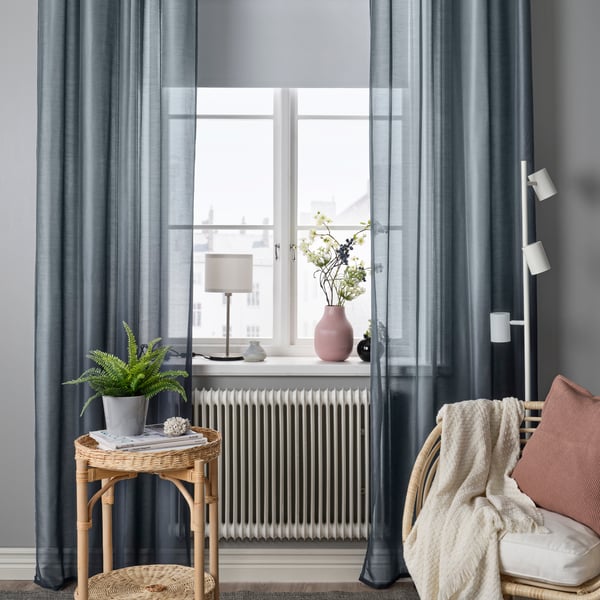 A white FRIDANS block-out roller blind