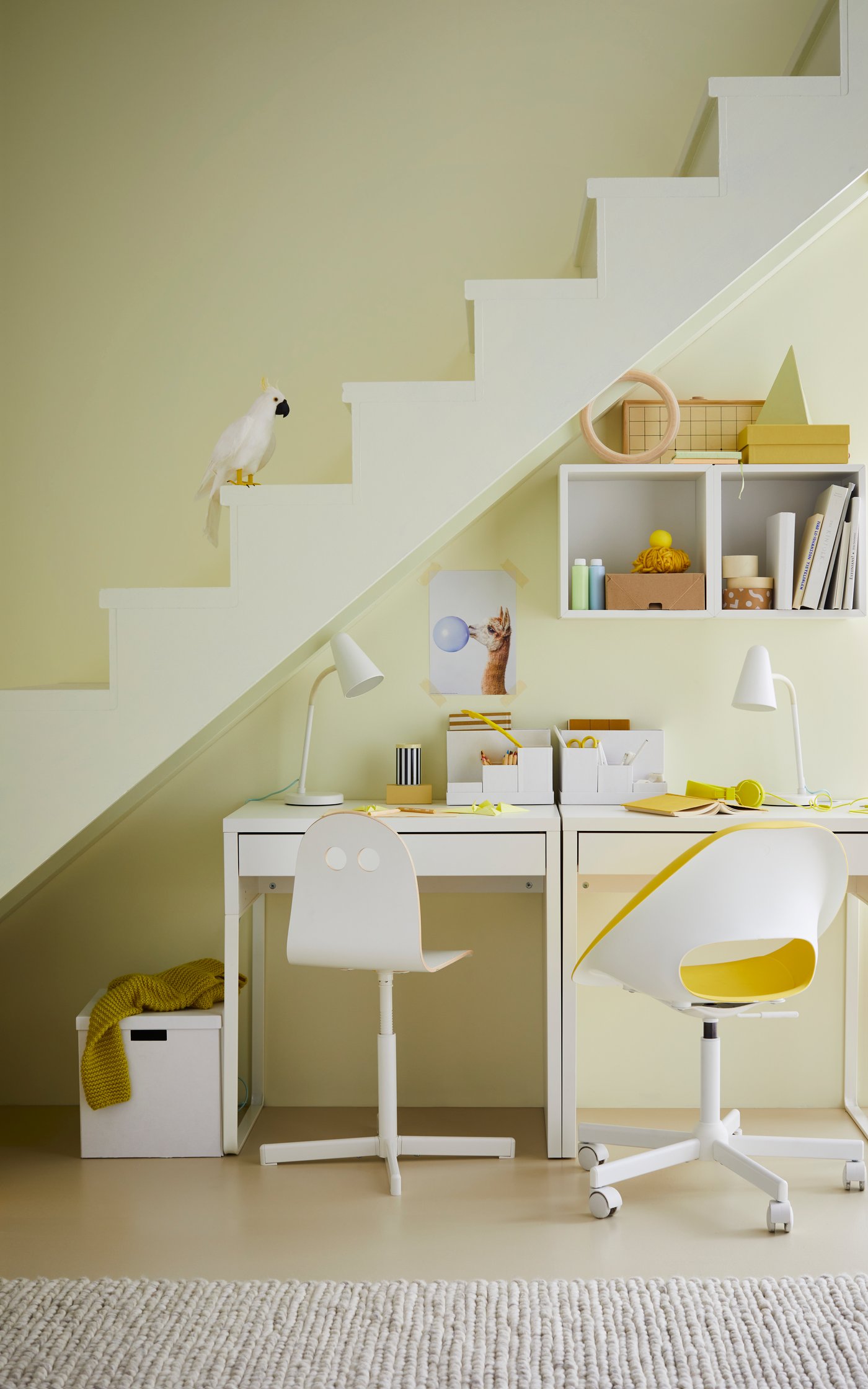 A white TJENA storage box with lid
