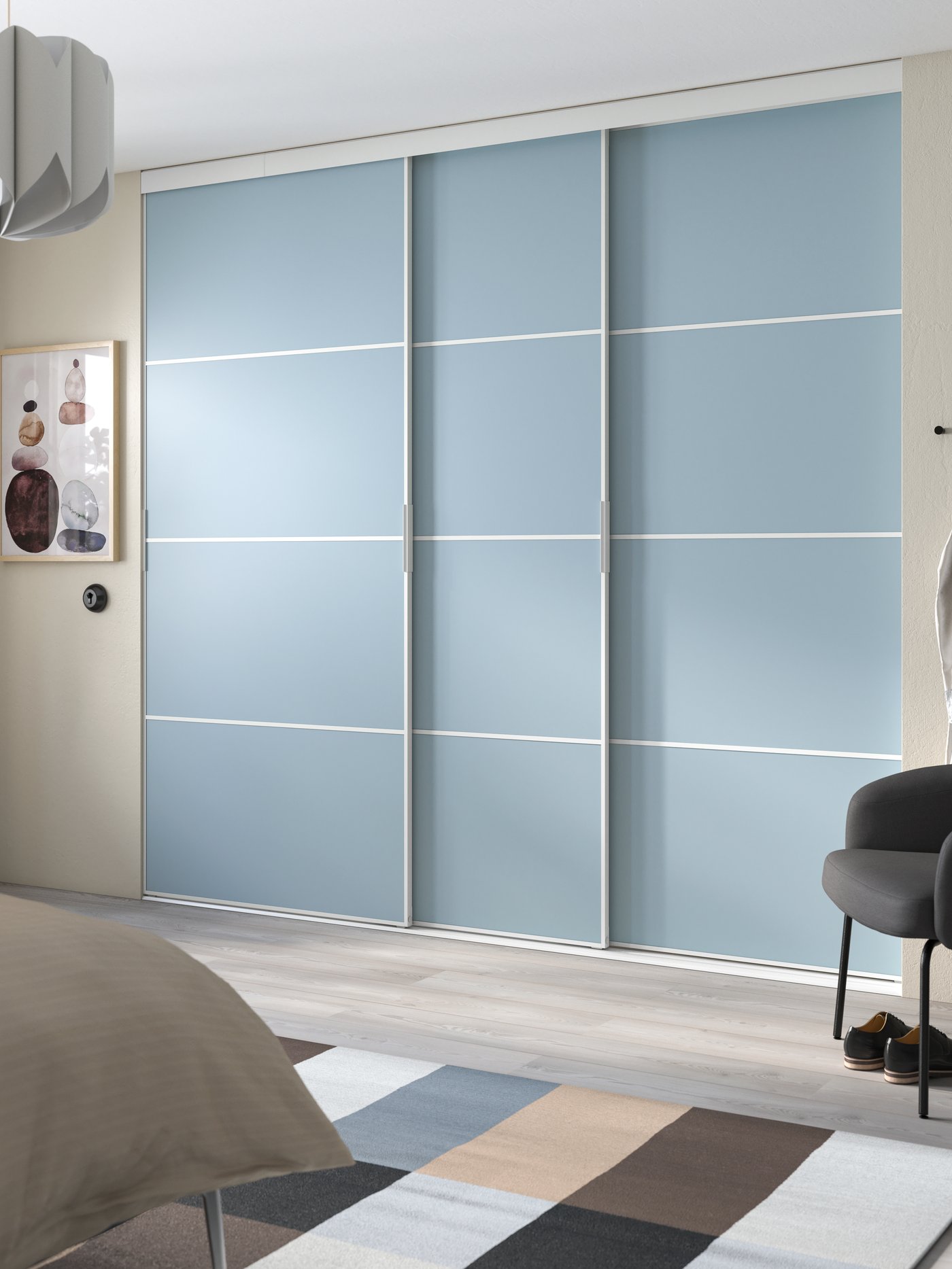 A white double sided/Mehamn light blue PAX walk-in wardrobe with sliding doors in the bedroom