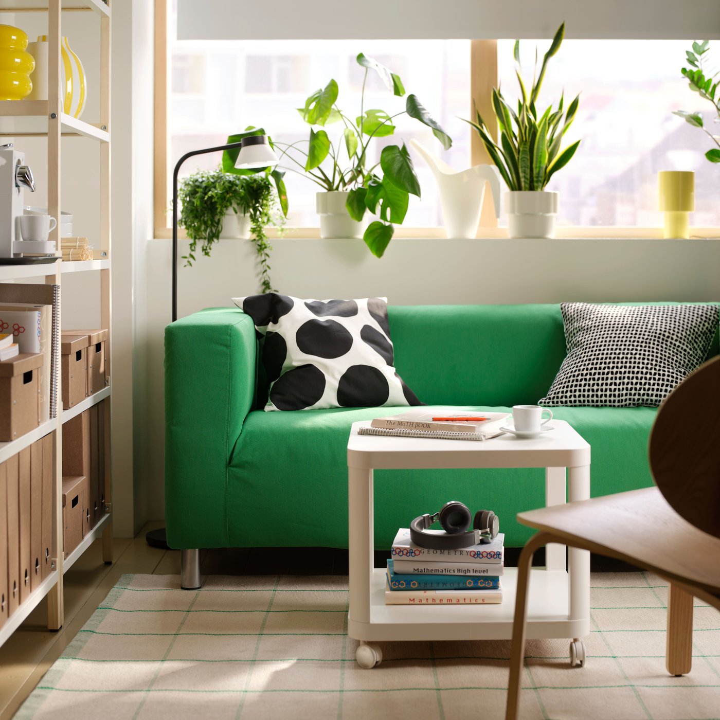 A living room setting with a vissle green KLIPPAN 2-seat sofa.
