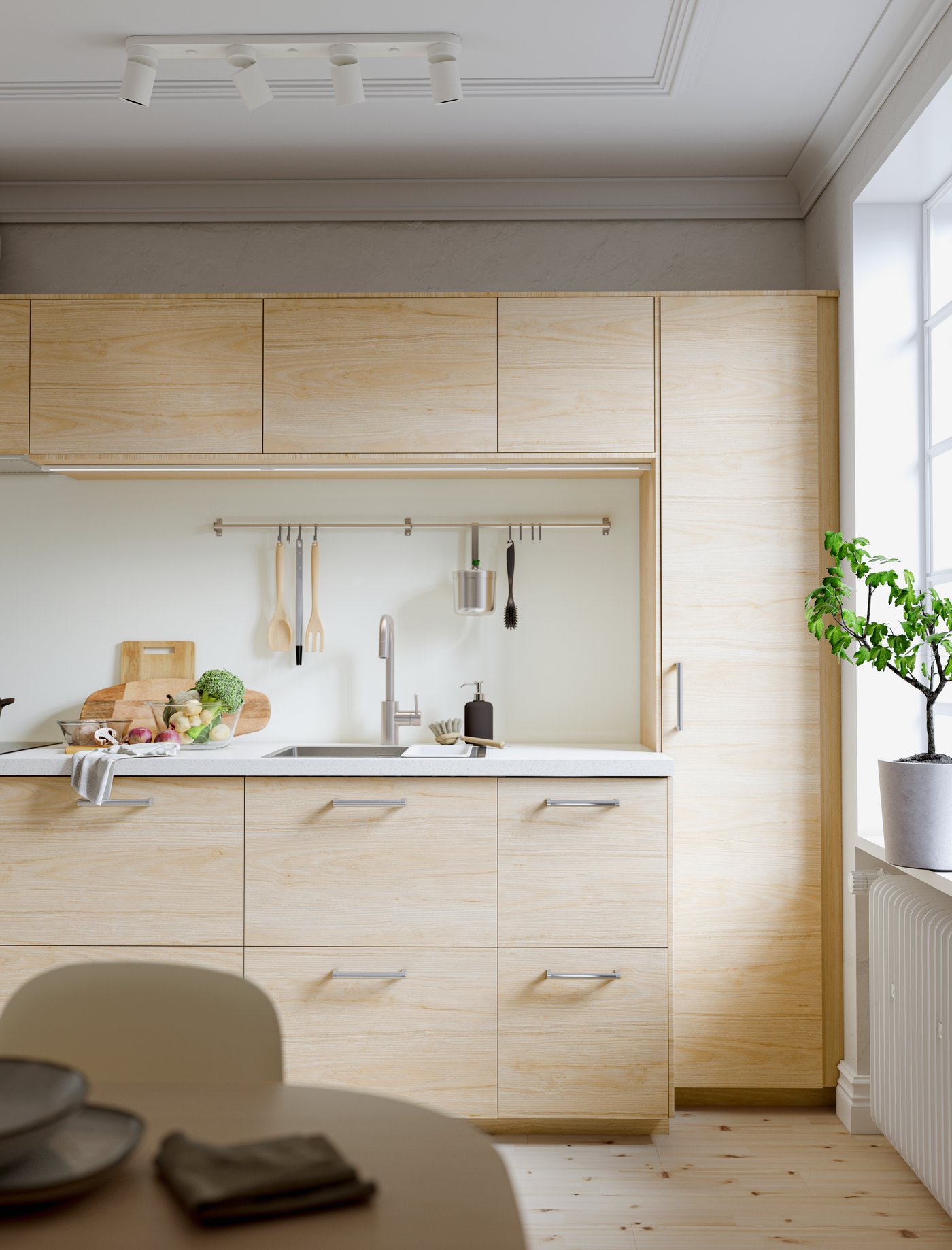 A white stone effect/laminate SÄLJAN worktop in the kitchen